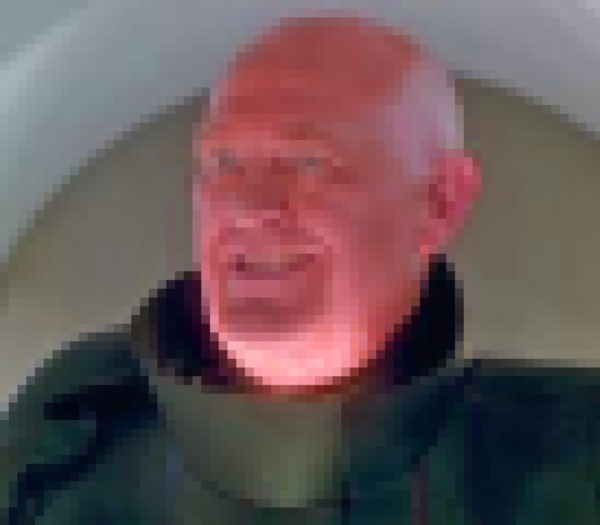 Chuck de Nomolos from Bill and Ted, a bald, old-ish man, slightly chubby, dressed in a back uniform